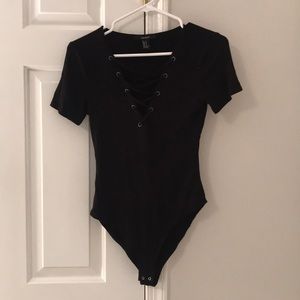 black crisscross detailed body suit